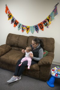 Student with child in Family Room 2015 