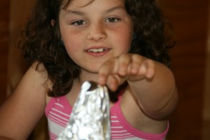 A 4H participant works on a model