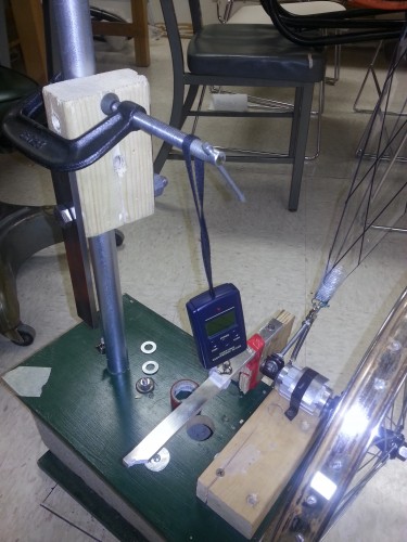 Prony brake to measure torque output. Brake is mounted on the free end of the shaft and has a lever arm that is attached to a digital scale that measures the force.