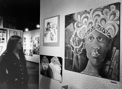 1971-An image scanned from a black and white photograph of a student viewing a painting in Carnegie Museum