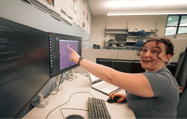A photo of Isabelle Puccio in a lab