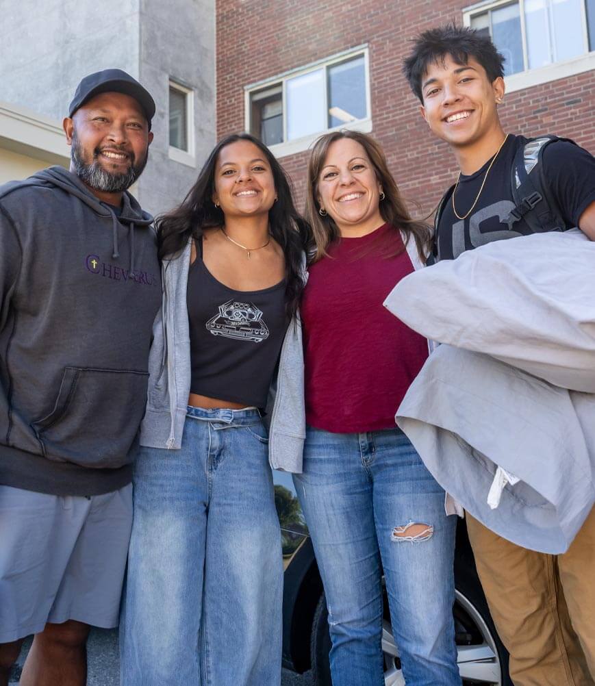 A photo of a student and their family on move-in day.