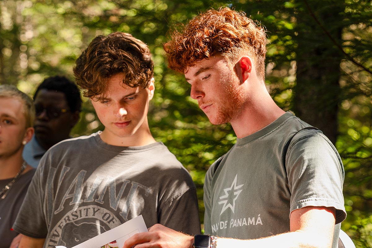 A photo of two students in the forest