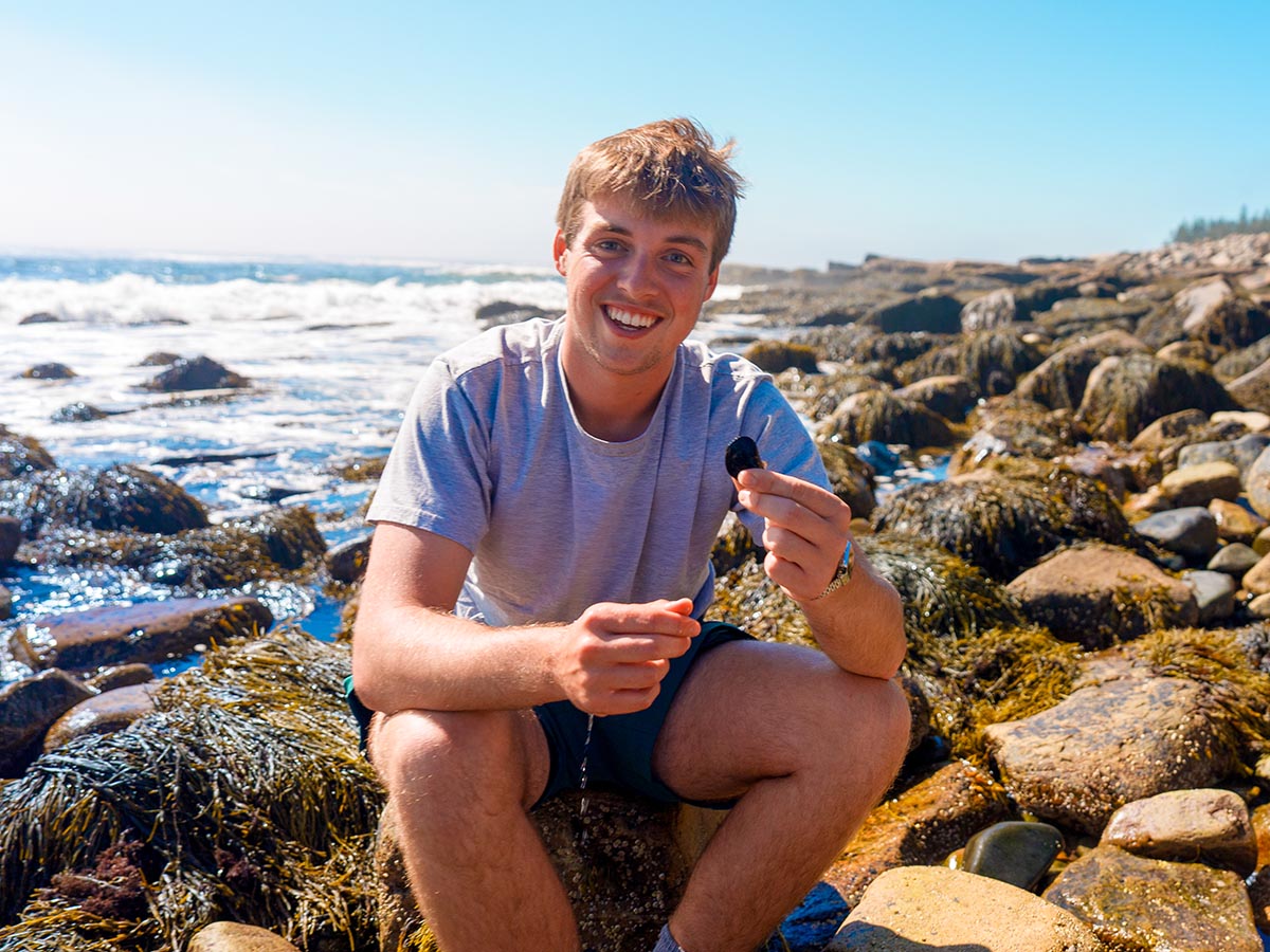 A photo of a person on Maine's coast