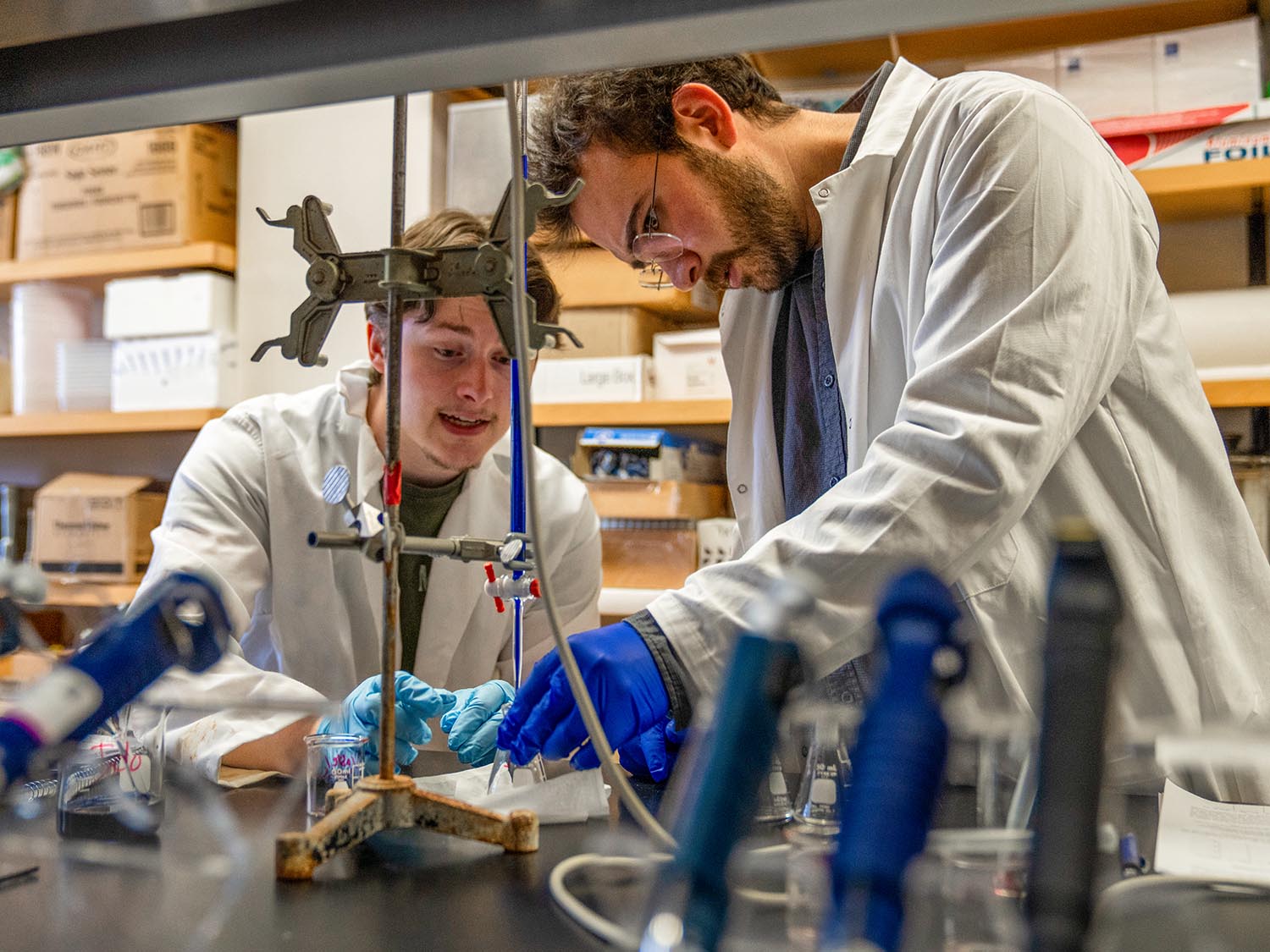 A photo of two students working in a food analysis lab