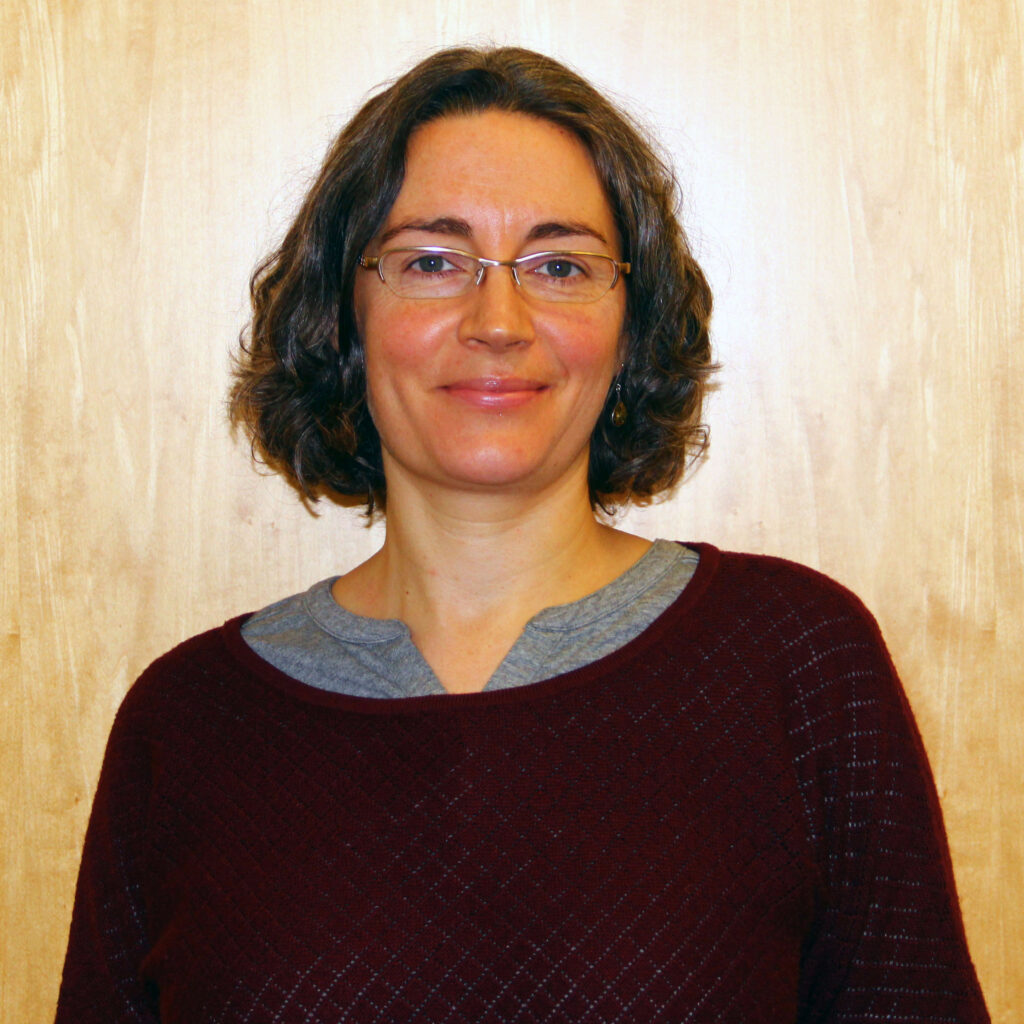 Profile picture of Helen Marasco facing the camera, shown from the shoulders up with a neutral background.