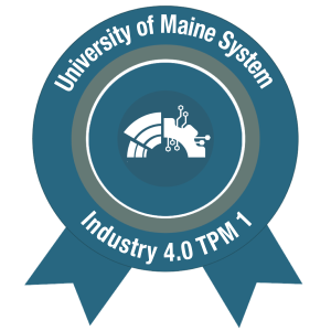The AMC B.O.T. Loft Level 3 Macro Badge for Industry 4.0 TPM 1, issued by the University of Maine System. Circular ribbon design features a stylized robotic arm and circuit icon, with text reading “University of Maine System” and “ Industry 4.0 TPM 1”