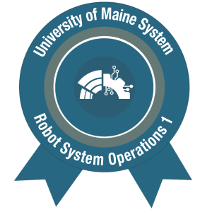 The AMC B.O.T. Loft Level 3 Macro Badge for Robot Systems Operations 1, issued by the University of Maine System. Circular ribbon design features a stylized robotic arm and circuit icon, with text reading “University of Maine System” and “Robot Systems Operations 1”