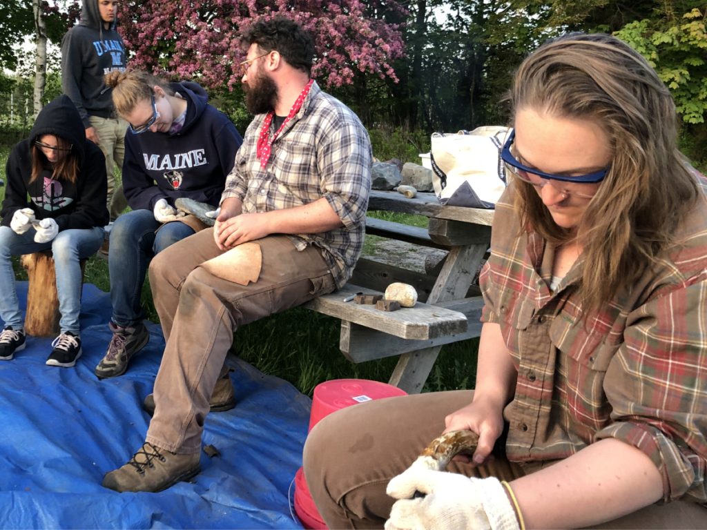 students practicing flintnapping