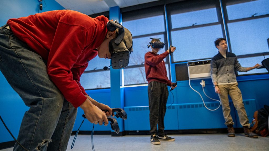 A photo of students wearing a VR headseat