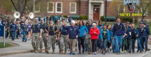 Army ROTC Cadets march with executive members of the UMaine faculty on Maine Day.