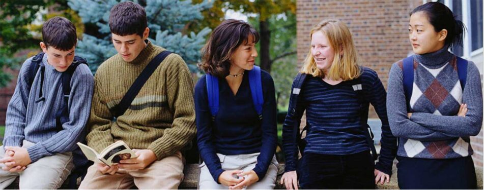 Group of teens outside academic building
