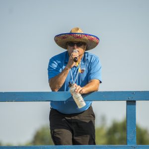 marching band director addressing band via microphone