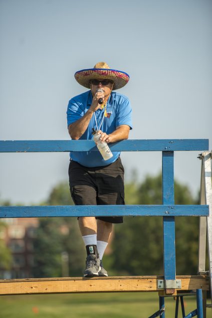 marching band director addressing band via microphone