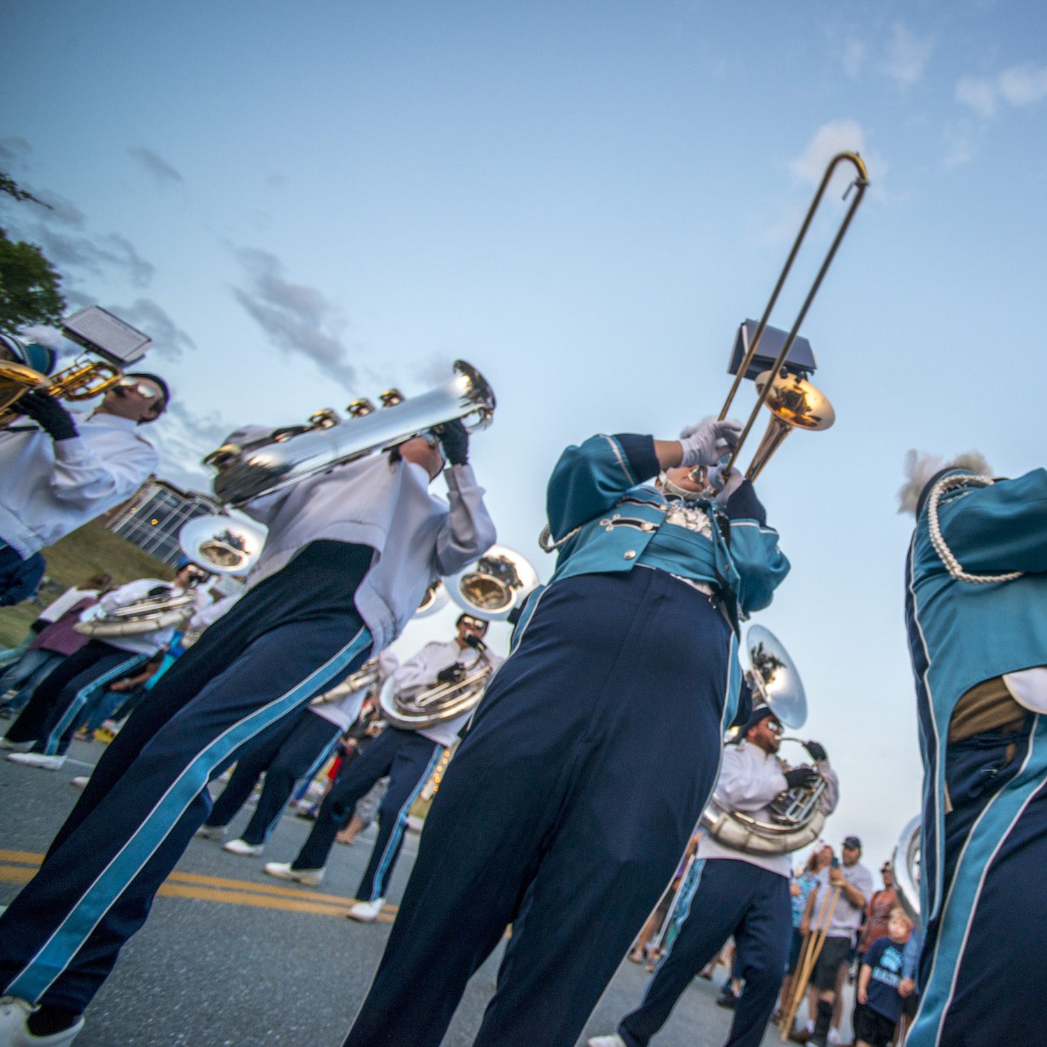 marching band trombones and baritone saxophones doing horn swings