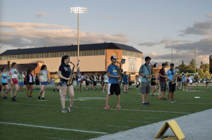 marching band rehearsing during band camp on Morse Field of Alfond Stadium at UMaine