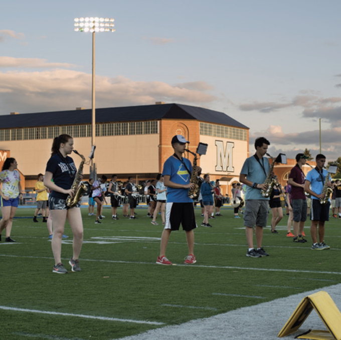 marching band rehearsing during band camp on Morse Field of Alfond Stadium at UMaine