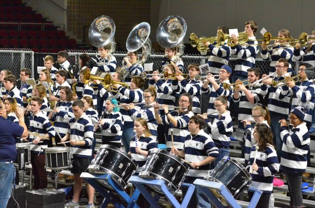 members of the pep band playing at cross insurance center, bangor