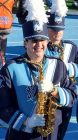 Band Member Holding a Saxophone