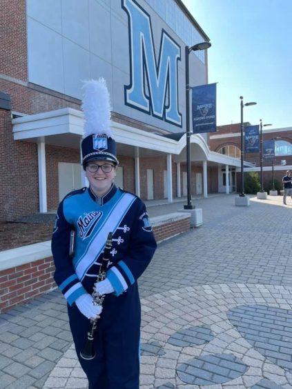 Band Member Holding a Clarinet