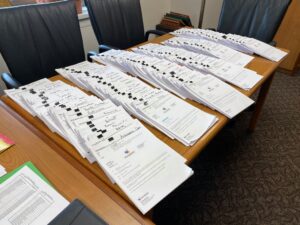 A photo showing packets of school work ready for pickup by families of students during remote schooling caused by the COVID-19 pandemic.