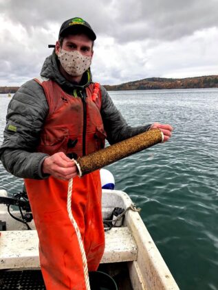 Student with seed for kelp line