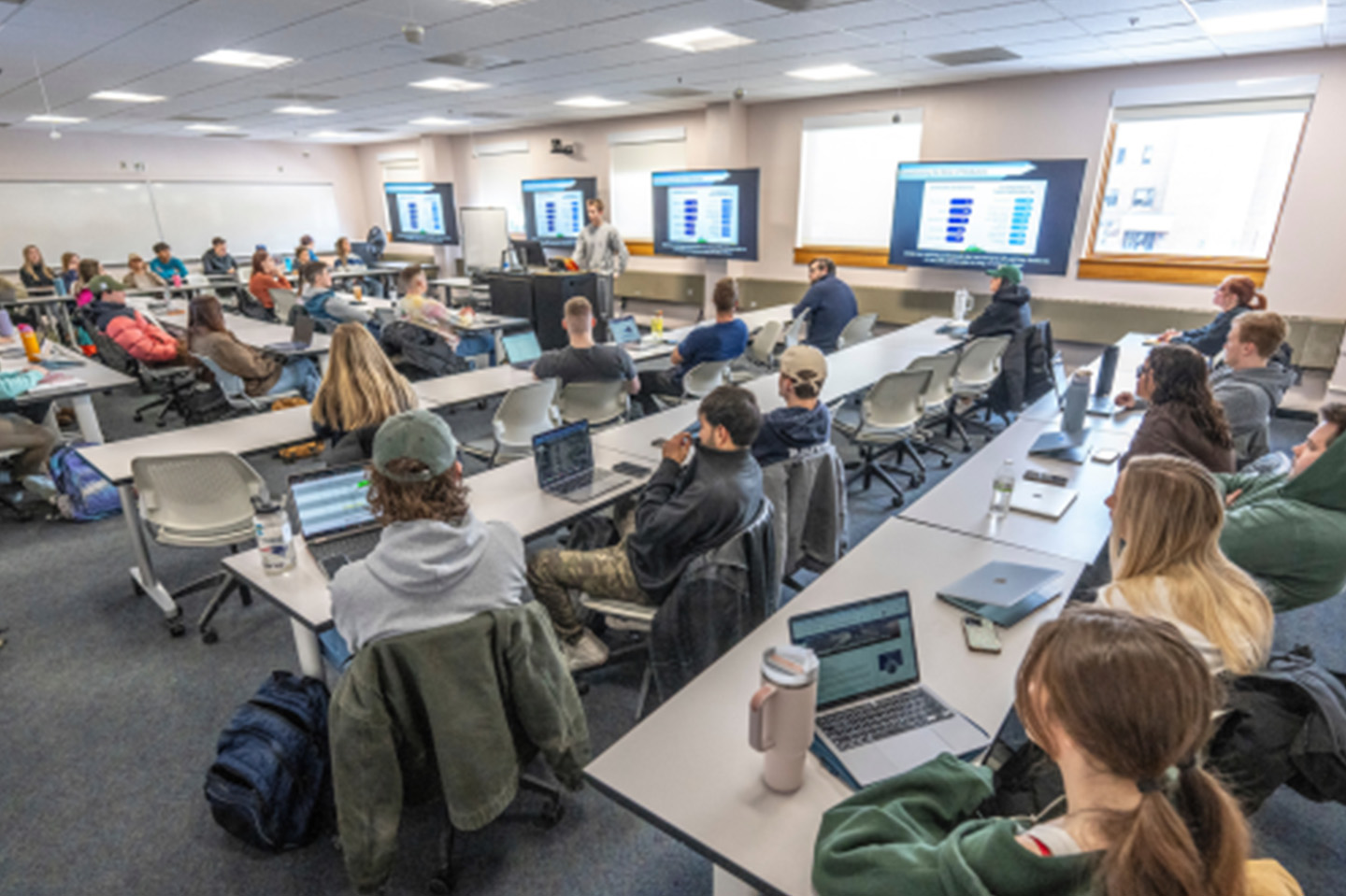 Classroom of business students with a professor at the front