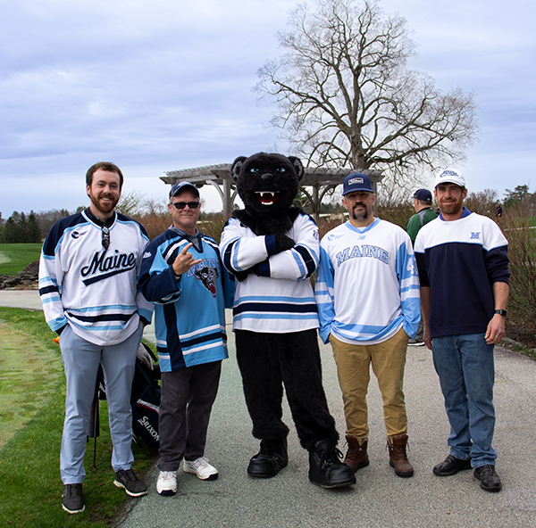 Bananas T. Bear poses with golfers at the MBS Golf Tournament