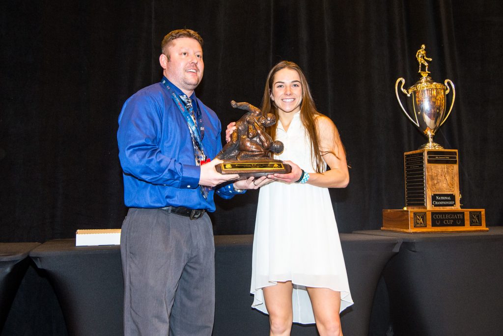 Image of Samantha Frank accepting an award