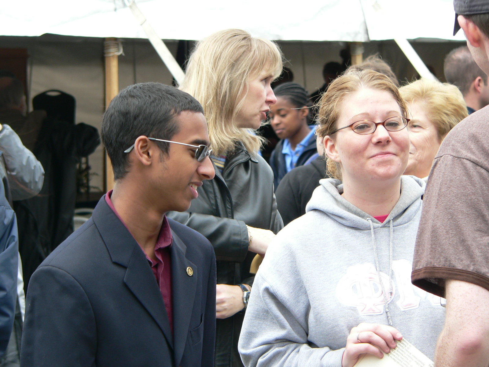 Two people interacting with a third at a public event hosted at the recreation center