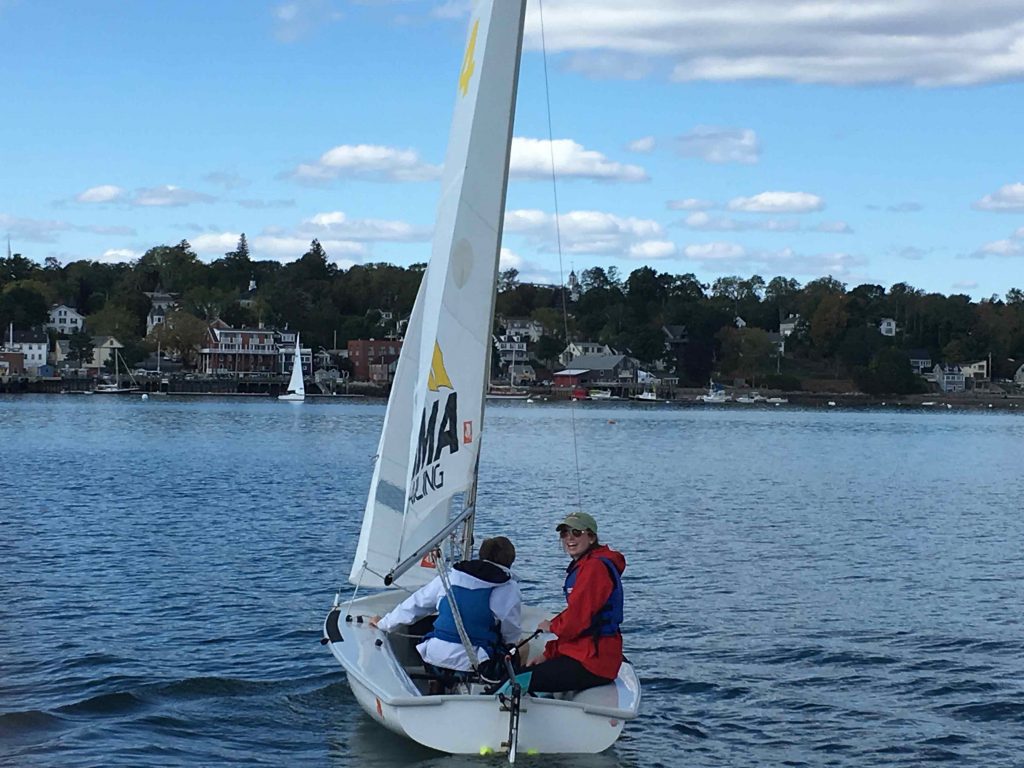 A sailboat on the water of a lake in Maine