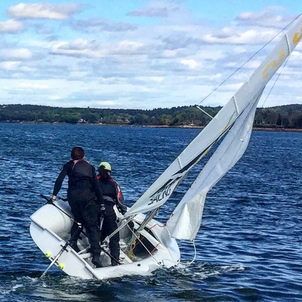 A sailboat on a lake in Maine