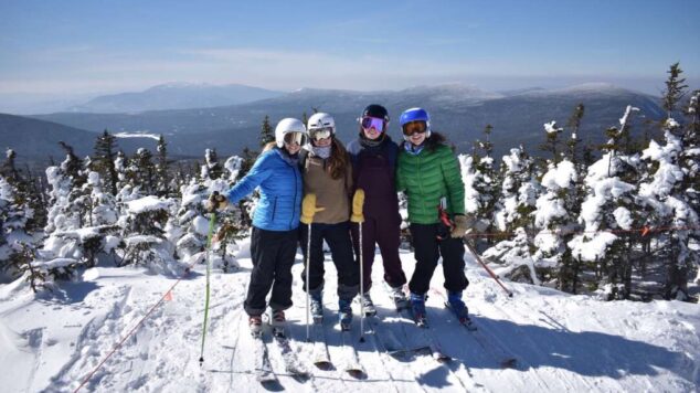 Team at top of mountain