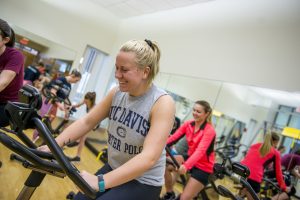 Picture of person righing exercise bike in a group class