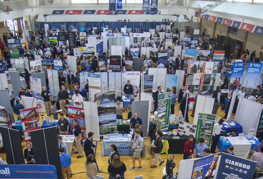 A picture of the career fair from up on the second floor looking down. Over 150 employer booths and all the people .