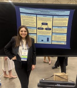 Katie with her poster at SRCD