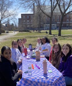 C-CAP Lab members sitting around a picnic table
