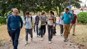 A photo of a group of students walking through downtown Bangor