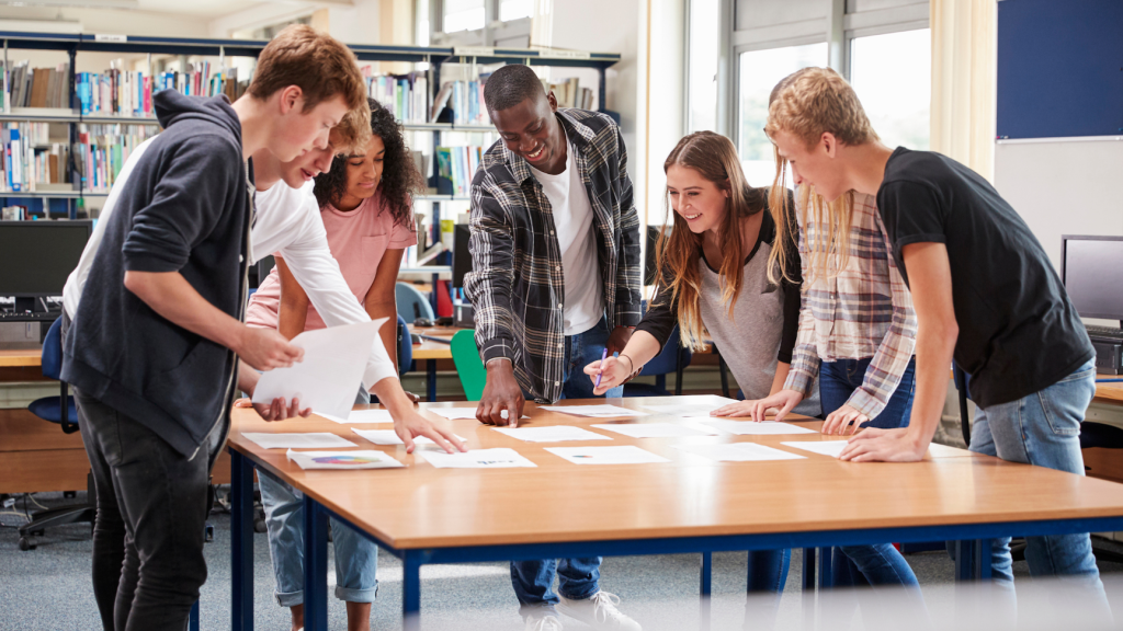 Graduate students working together around a table