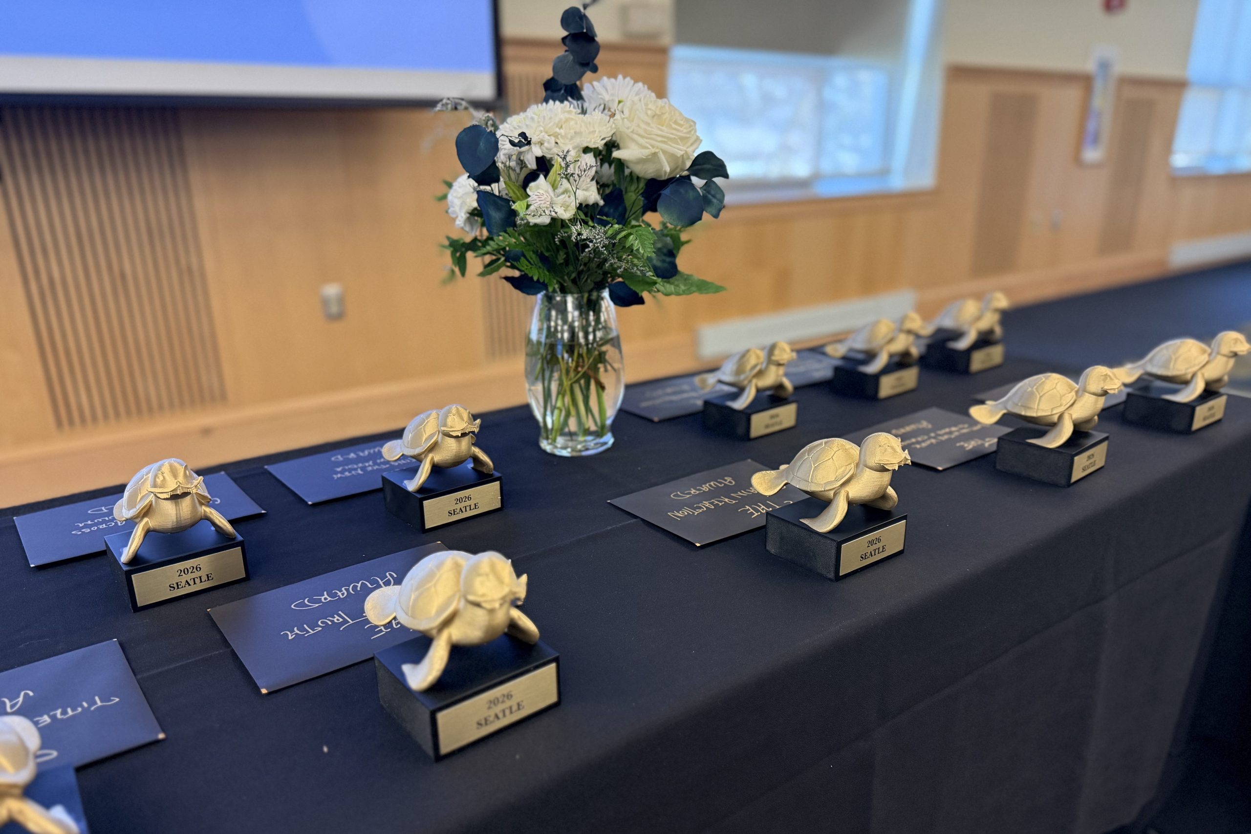 A table that is displaying the SEATE trophies that each award recipient gets as an acknowledgment of the award.