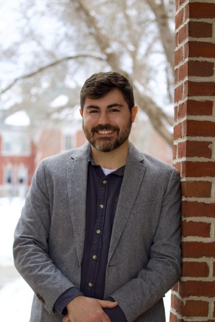 Portrait of Dr. Ryan LaRochelle outside on the UMaine campus.