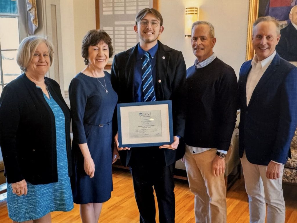 A photograph of Senator Collins presenting the first Patricia and Donald Collins Scholarship to Keegan Tripp, 2025