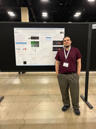 Josh in front of his BMES 2022 poster