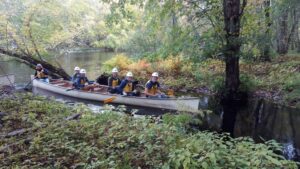 CET students paddling a war canoe