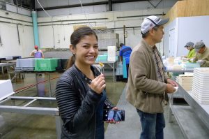 Graduate student Diana Maria Cuesta Gomez samples sea urchin roe at the processing plant