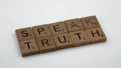 ID: Scrabbles that Says "SPEAK TRUTH"