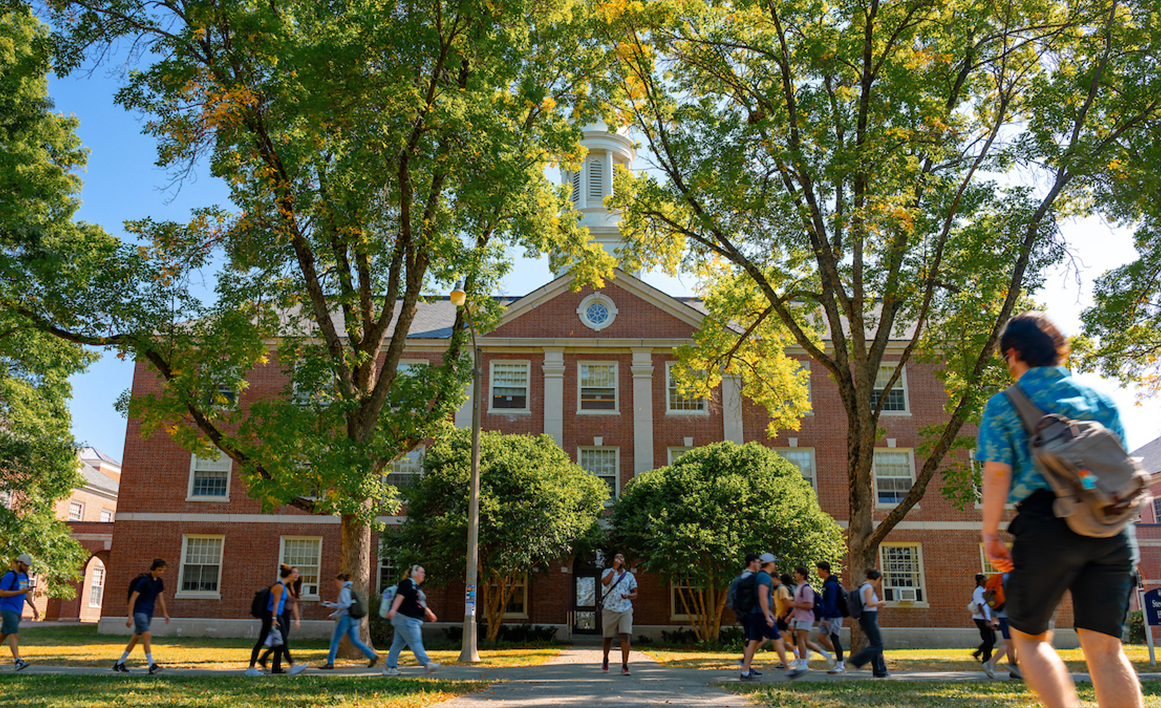 A photo of students walking along the mall