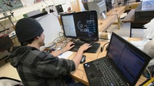 photo of student working at a computer station