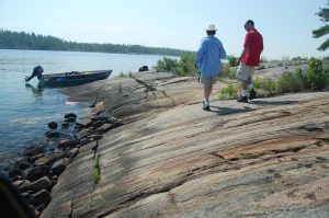 walking on the shore back to the boat