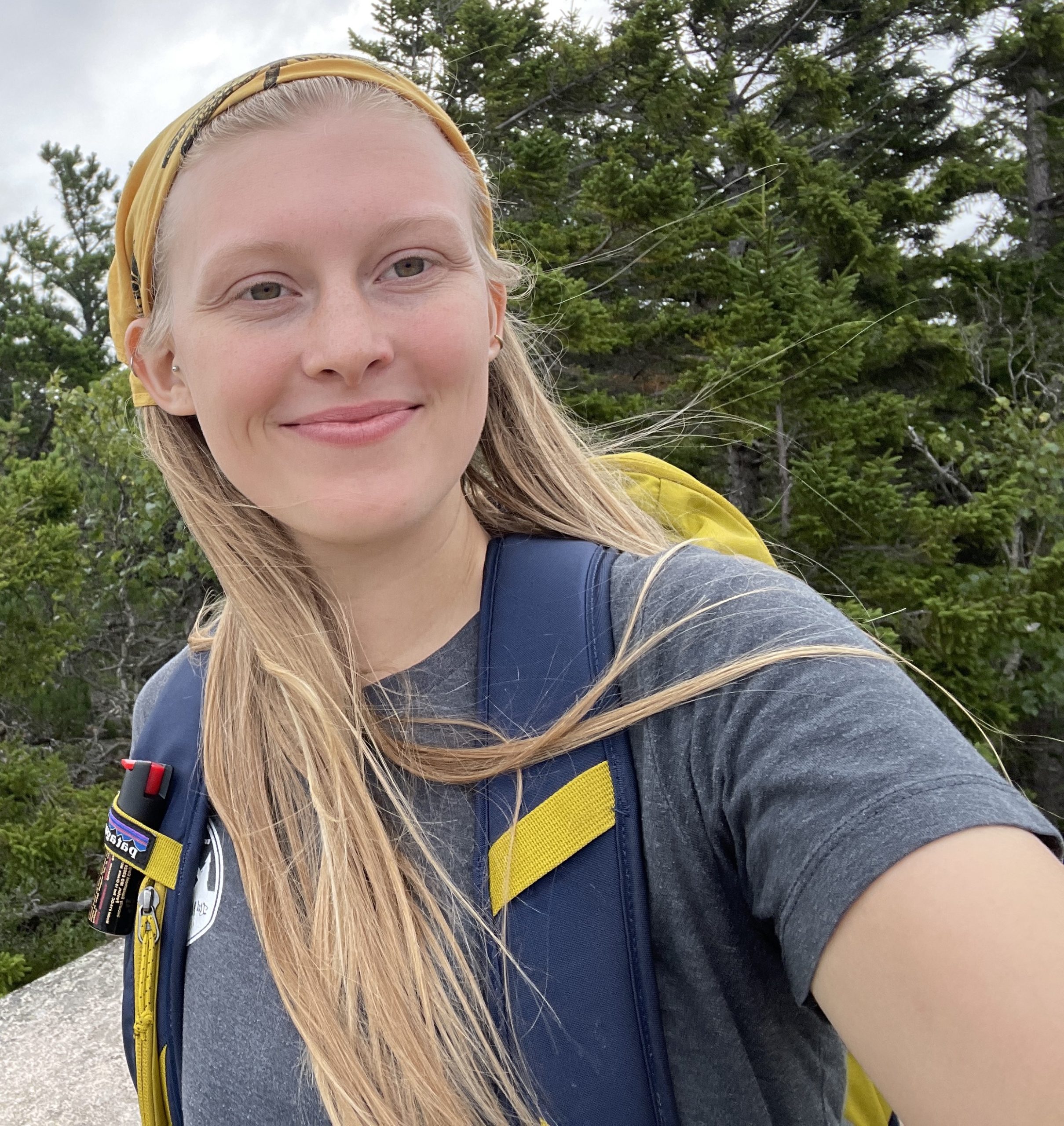 Kayla Guthrie posing in front of trees